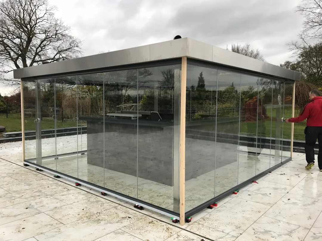Retractable frameless glass patio enclosure