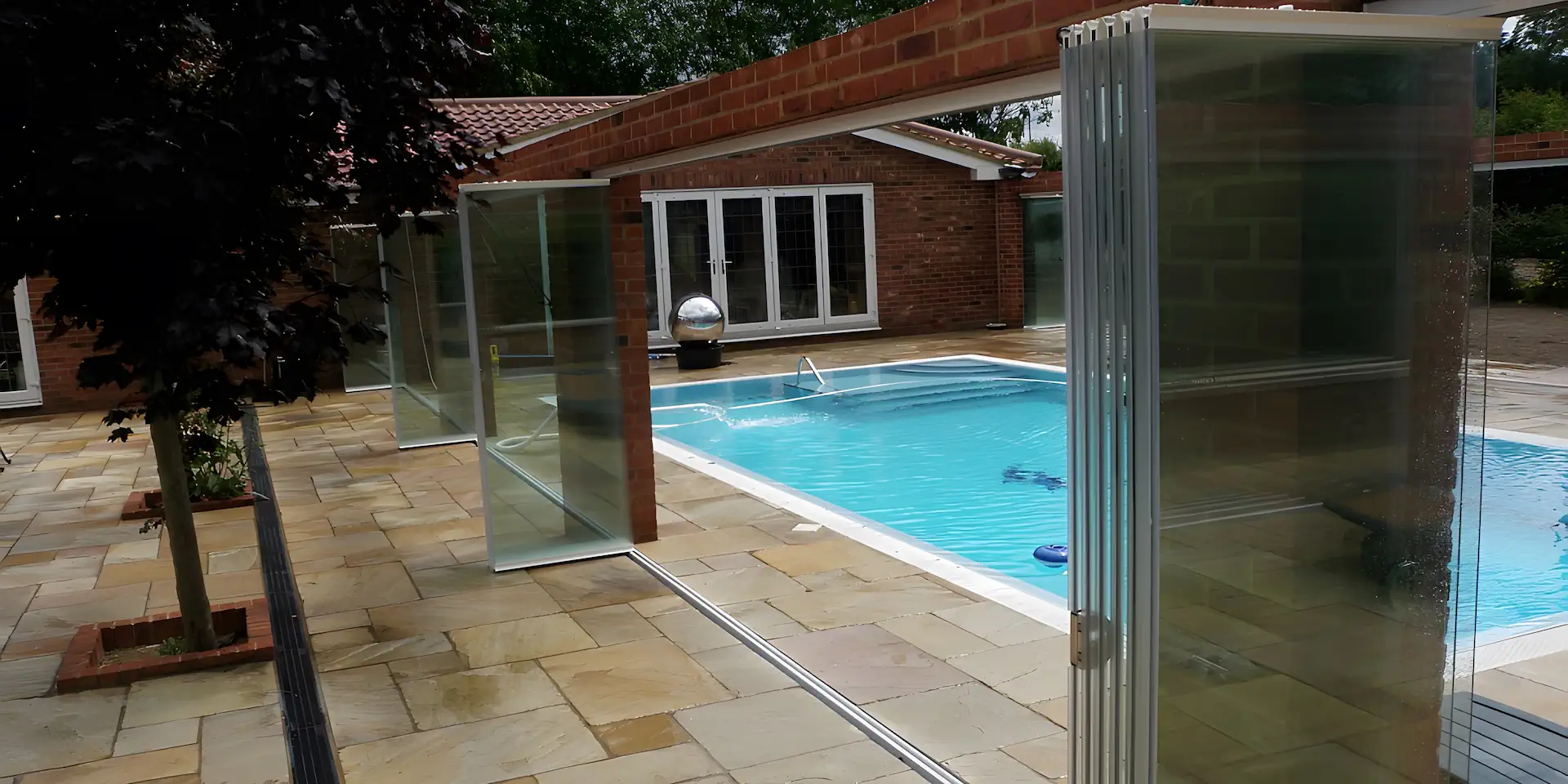 Outdoor frameless glass swimming pool enclosure