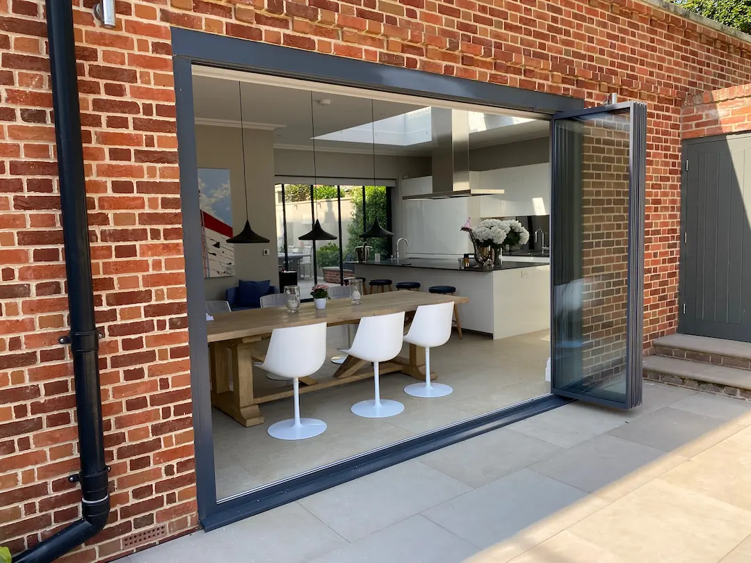 anthracite bifold doors in brick open plan house