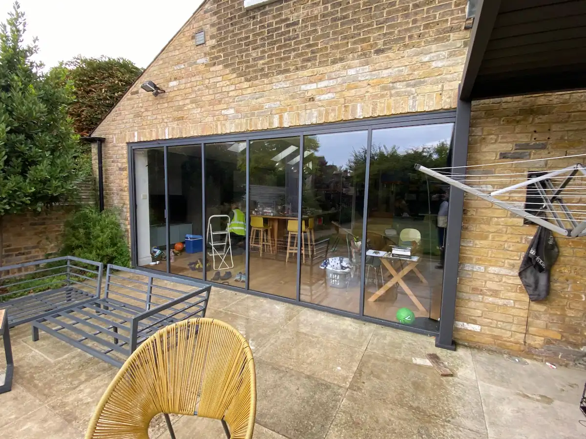 anthracite bifold doors with matching garden furniture