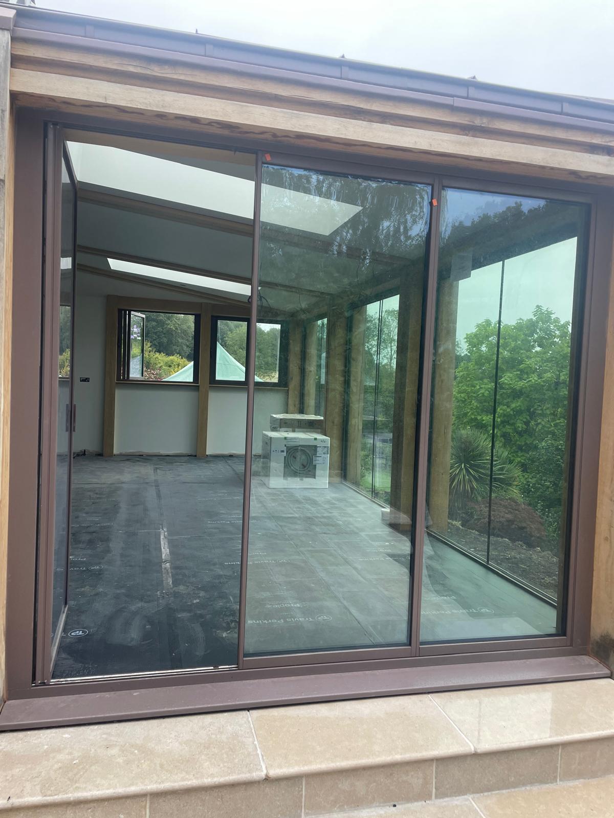 brown bifold garden room doors