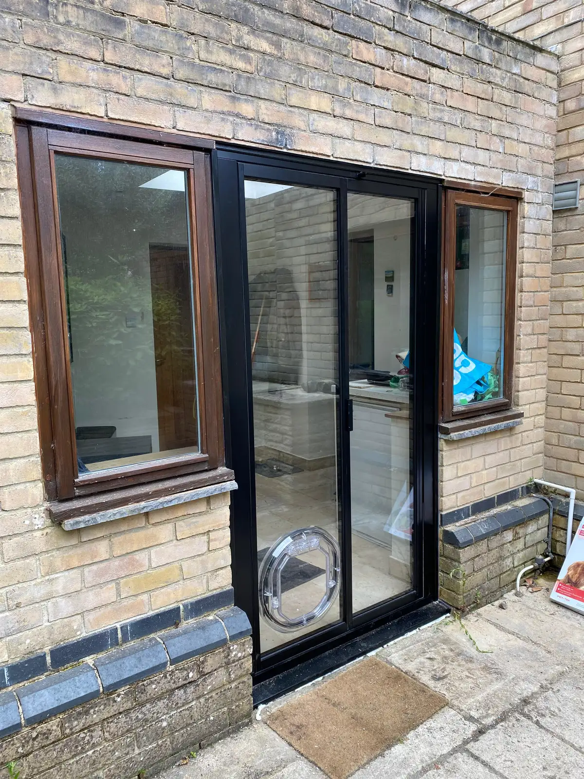 french doors with side windows and pet flap