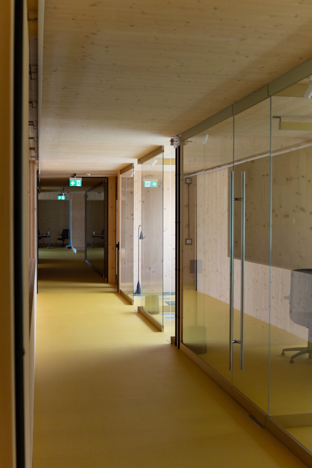 long corridor with glass office partitions