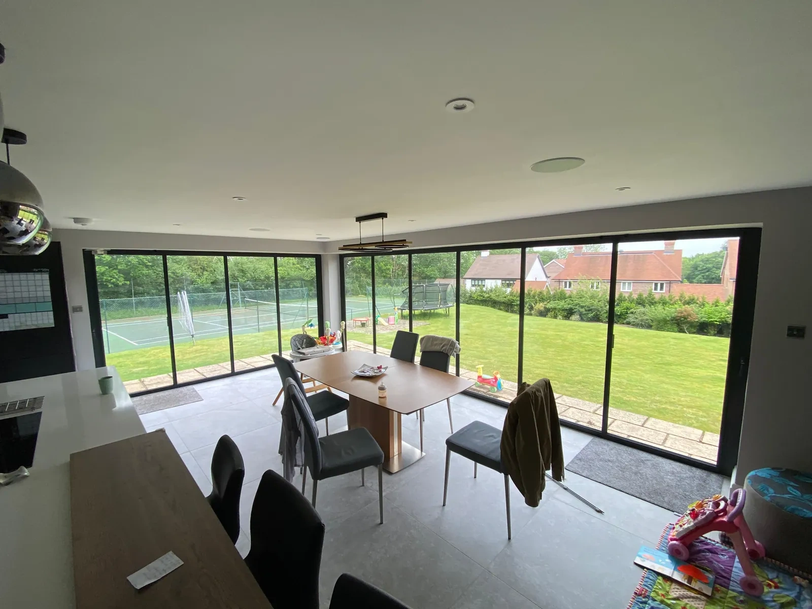 ultra slim modern concertina doors in a large open plan living room