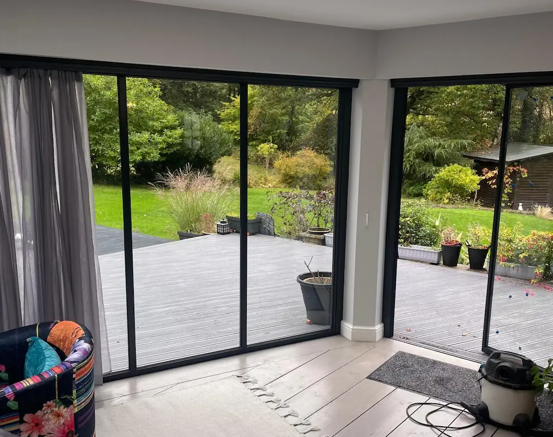 living room black sliding doors with curtains