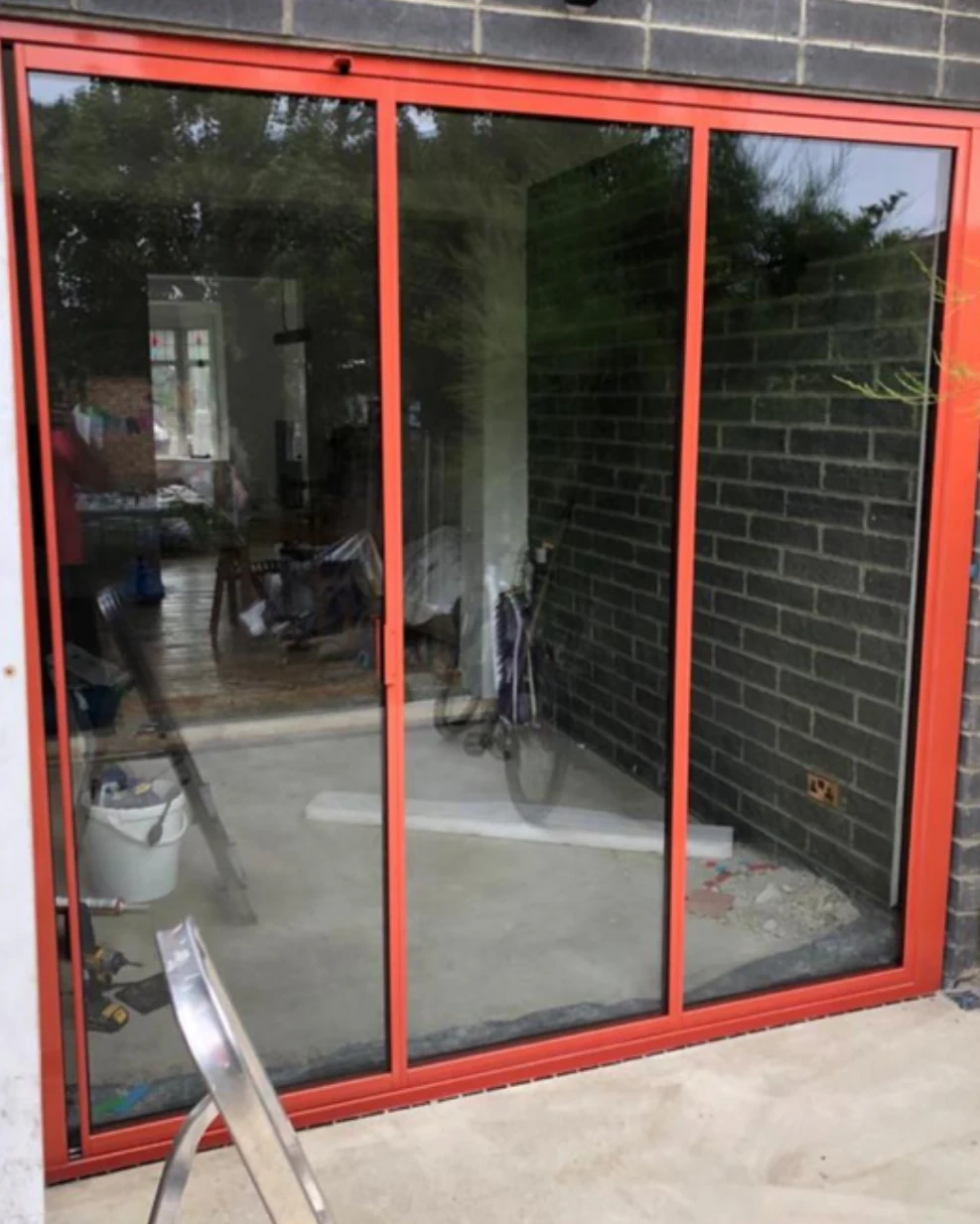 red powder coated aluminium bifold doors