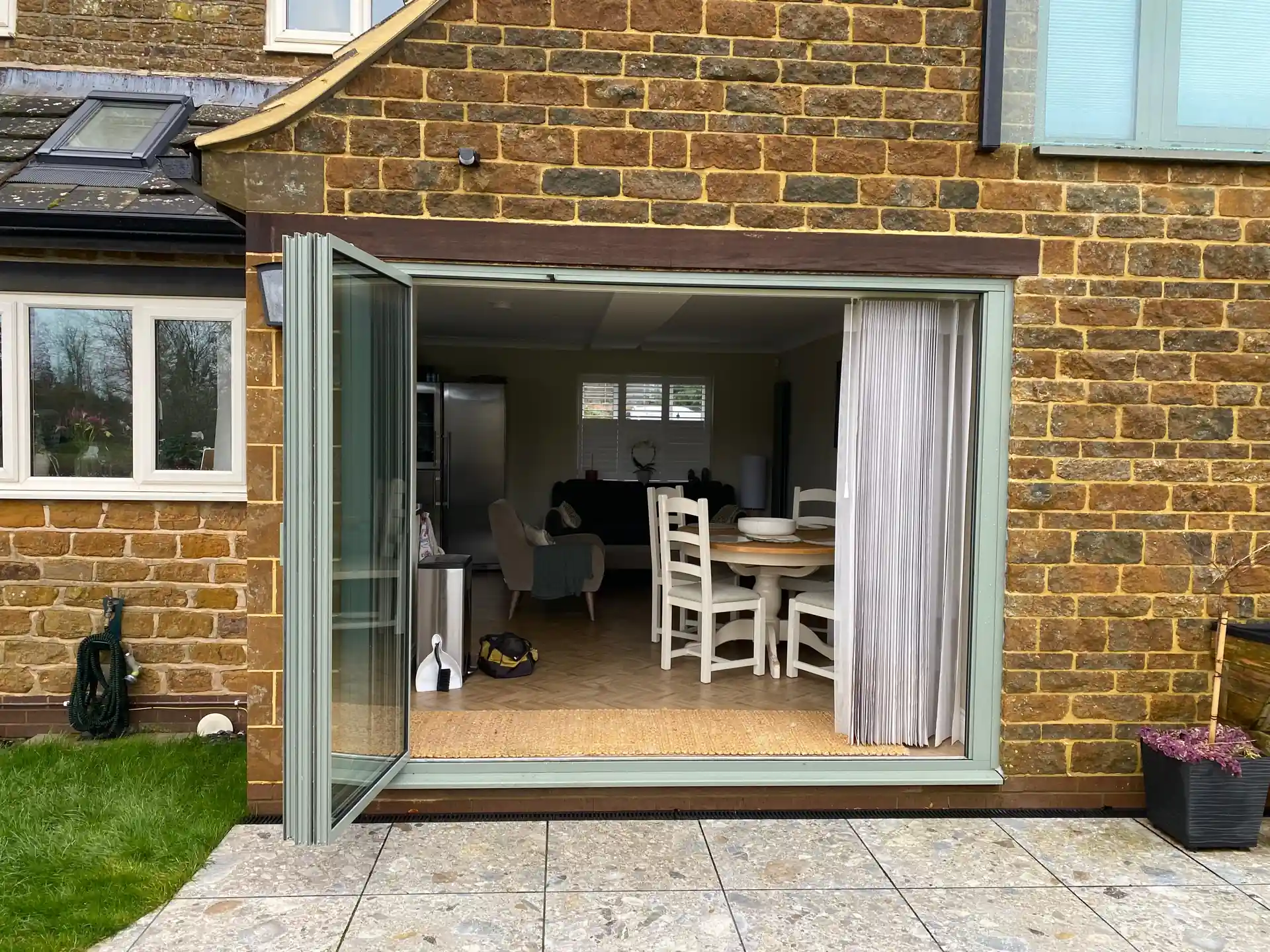 green coloured bifold doors