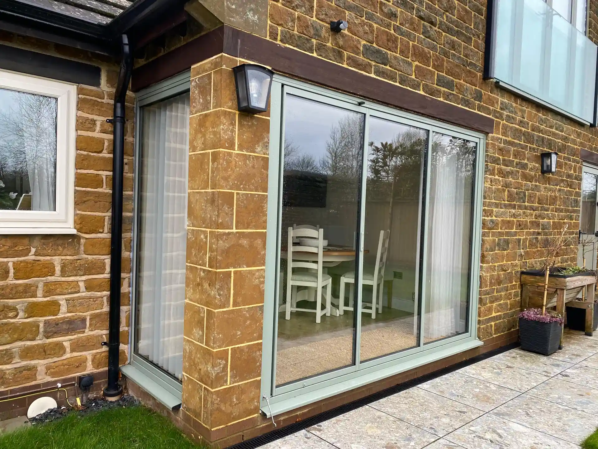 green kitchen extension sliding doors