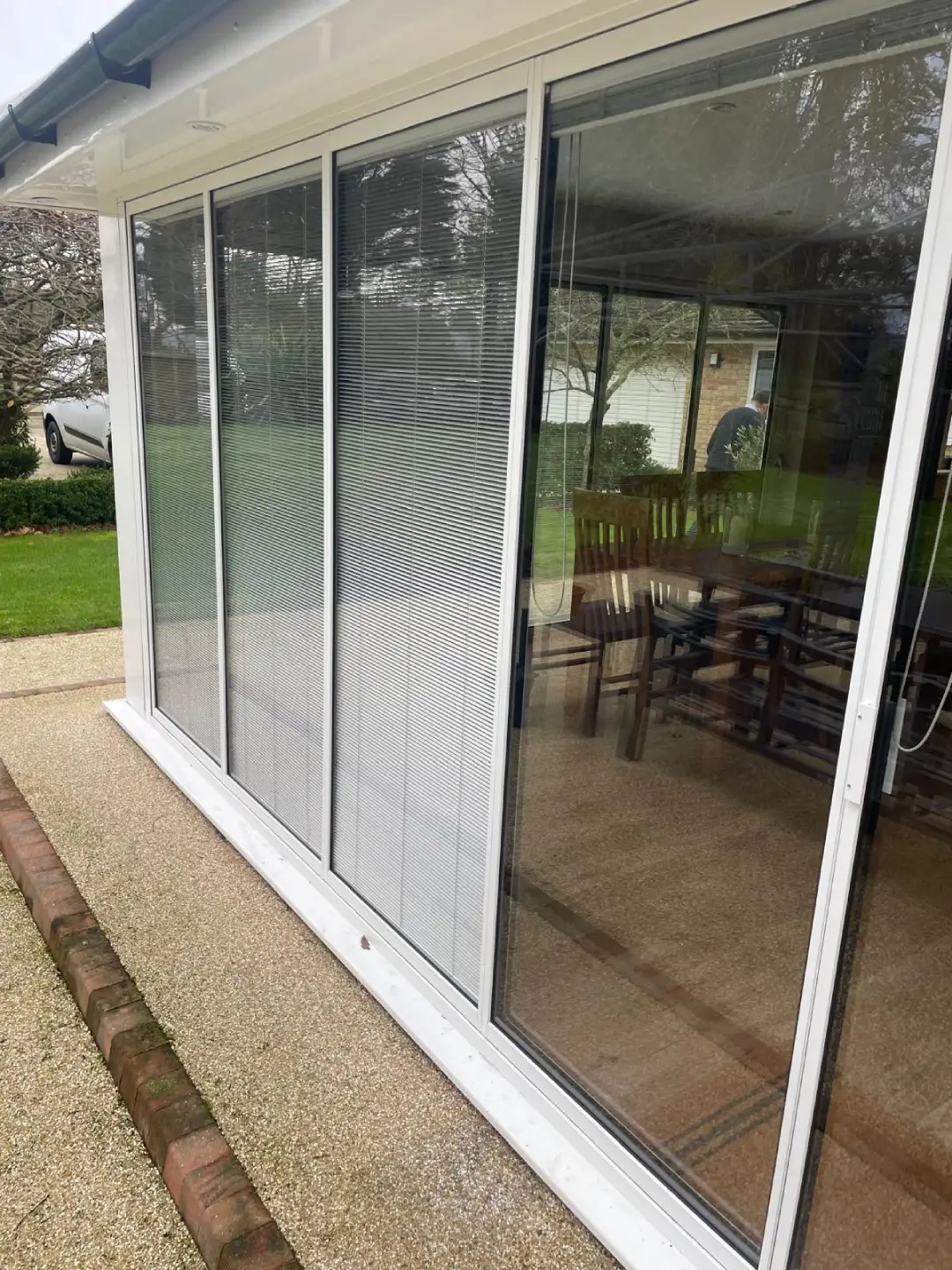 white sliding doors with integrated blinds